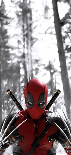 a deadpool character standing in the woods with his arms crossed and two swords out