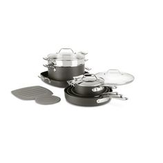 an assortment of pots and pans with lids