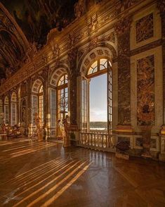 an ornately decorated room with large windows