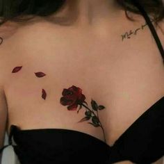 a woman with a rose tattoo on her chest