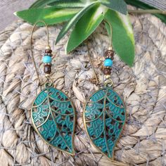 These Women's Earrings Are An Excellent Addition To Any Jewelry Collection. The Bronze Metal Gives Them A Unique And Stylish Look, With Beaded Detailing That Adds A Boho Vibe. The Earrings Feature A Leaf Shape In A Beautiful Blue Color, Making Them Great For Any Occasion. Perfect For Those Who Love Handcrafted And Artisan Jewelry, These Earrings Are A Must-Have For Fashion-Forward Women. They Are Perfect For Adding A Pop Of Color To Any Outfit, And The Dangle/Drop Style Makes Them A Great Choice Turquoise Bohemian Earrings For Beach, Bohemian Turquoise Earrings For Beach, Blue Leaf-shaped Jewelry For Gift, Blue Leaf-shaped Jewelry Gift, Vintage Turquoise Earrings For Summer, Turquoise Metal Beaded Bohemian Earrings, Turquoise Bohemian Beaded Earrings For Pierced Ears, Bohemian Leaf-shaped Metal Earrings, Bohemian Leaf-shaped Metal Jewelry