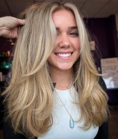 Long Blonde Face Framing Haircut