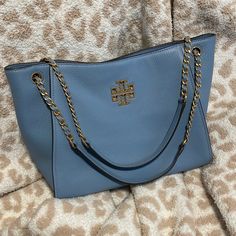 Only Used A Couple Times In Great Condition. Great Shoulder Bag With Lots Of Space. Magnetic Closure With 2 Zippered Pockets And 1 Open Pocket. Gorgeous Blue Color That Goes With Anything And Everything! 9” Tall (18” With Strap), 13” Long And 5” Deep. Blue Shoulder Bag, Tory Burch Bags, Tory Burch Bag, Magnetic Closure, Blue Gold, Tory Burch, Bag Lady, Blue Color, Shoulder Bag