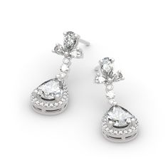 Celebrate one of the most unforgettable moments of your life with this joyous expression of love. Crafted in sterling silver, each earring features a pear-cut center stone wrapped in a halo of shimmering round stones, which shows a really exquisite look. Glittering in bold brilliance, additional stones add more sparkle. Treat yourself or surprise her with this masterpiece.Carat Weight: 6.982 ctStone Size: 2,1,2*3,3*5,6*8 mmStone Type: Jeulia® StoneNumber of Stones: 60 Stone Shape: Round, PearSto Elegant Diamond White Cluster Earrings With Halo Setting, Elegant Halo Cubic Zirconia Diamond Earrings, Elegant Cubic Zirconia Halo Diamond Earrings, Elegant Cluster Earrings With Halo Setting For Anniversary, Elegant Halo Cluster Earrings As Gift, Elegant Diamond Bridal Earrings With Halo Setting, Elegant Cubic Zirconia Cluster Earrings With Halo Design, Elegant Bridal Earrings With Halo Setting Diamond, Elegant Halo Diamond Earrings For Anniversary