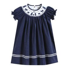 Navy Blue Corduroy Nativity Smocked Bishop Dress Charming and cute! Your little cuties closet is not complete without this adorable outfit. They will love spending their days in this outfit made out of 100% soft cotton. Cute details make it a one of a kind addition to their closet. This Bishop dress is the traditional length with hemline reaching the calf/ankle. From festive activities or just fun days at home your little sweetie will be ready and picture perfect! -100% Cotton -Machine Wash -Man Playful Cotton Dress With Smocked Bodice, Cotton Dress With Smocked Back For Playdate, Playful Cotton Smocked Playtime Dress, Cute Smocked Dress For Playtime, Cotton Smocked Dress With Short Sleeves And Smocked Bodice, Cotton Smocked Dress With Short Sleeves, Blue Casual Cotton Smocked Dress, Casual Blue Cotton Smocked Dress, Cotton Smocked Dress For Playtime