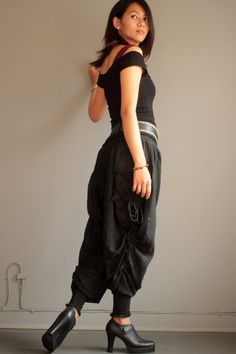 "Our new funky harem pants. A simple version for daily style! Made with super soft and comfy linen/cotton fabric. The fabric is flowy, has great stripe texture and semi-sheer. Elastic back waist. Drop-crotch harem pants style. Shirring cuff hem.gathered in small pleats around the waist to create volume. Special detail on the side with drawstring along the leg that you can adjust and get a different look. Big side pockets.The shirring hem allow you to wear the pants full length or Capri length. Y Fitted Cotton Harem Pants For Festivals, Black Cotton Harem Pants With Drawstring, Fitted Cotton Harem Pants, Trendy Black Cotton Harem Pants, Black Harem Pants For Spring Festival, Casual Fitted Harem Pants For Festival, Casual Drop Crotch Pants For Festival, Black Cotton Hippie Harem Pants, Casual Drop Crotch Harem Pants For Festivals