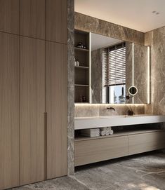 a large bathroom with marble walls and flooring