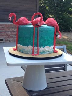 there is a cake with flamingos on it