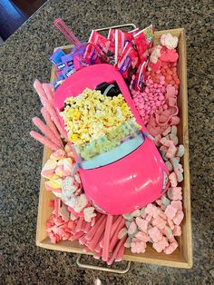 a tray filled with candy and candies on top of a table