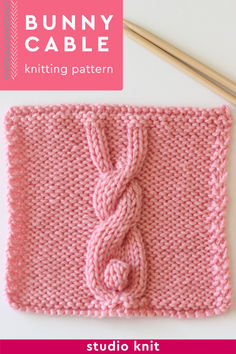 the bunny cable knitting pattern is knitted in pink yarn