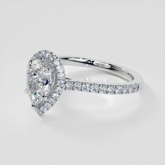 an oval cut diamond ring with pave set shoulders