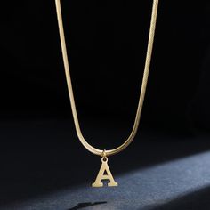 Let your style shine with this A-Z Alphabet Gold Plated Stainless Steel Pendant Necklace! Crafted of durable gold-plated stainless steel for a lasting shine, this stylish necklace will have you looking like a timeless fashionista. Make a statement today. Minimalist Gold Stainless Steel Name Necklace, Gold Metal Initial Pendant Necklace, Gold Metal Pendant Initial Necklace, Gold Minimalist Initial Necklace In Stainless Steel, Minimalist Gold Stainless Steel Initial Necklace, Tarnish Resistant Stainless Steel Initial Pendant Necklace, Tarnish-resistant Stainless Steel Initial Pendant Necklace, Stainless Steel Tarnish Resistant Initial Pendant Necklace, Trendy Gold Metal Name Necklace