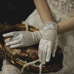 Product Specifications: Brand Name: Noble Weiss Origin: CN Material: Polyester Bridal Gloves Style: Finger Gloves Size: One Size Gloves Length: Over Wrist Gender: Women Department Name: Adult Technics: Pearl Beaded Item Type: Bridal Gloves Model Show Pearl Gloves, Prom Gloves, Bride Gloves, Short Bridal Dress, Elegant Gloves, Short Gloves, Embellished Shorts, Wedding Tea, Wedding Gloves