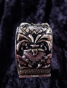 This pretty vintage cuff bracelet is not marked, but it has what looks like SG or SC (Sarah Coventry)scrolled into design by hinge. It has a pretty vintage style patina possibly silver plate as it has not tarnished. It has a dark antiquing that's mostly in recessed areas of the design. This bracelet is 1 3/8 inches thick. It closes completely on a size 7 wrist, and moves around slightly. The condition is great. We ship USPS, usually the next day. Our shop combines shipping and a shipping discoun Vintage Cuff Bracelet, Pressed Metal, Wrist Jewelry, Blue Milk, 21st Gifts, Sarah Coventry, Sunflower Design, Coventry, Cuff Bangles