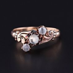 Antique Moonstone Ball Ring:  Old world elegance will be at your fingertips with this charming 10k moonstone ring (circa 1900).  The ring features a slant of three undrilled moonstone beads mounted in pale 10k rose gold.   The ring is currently a size 5.5, but it can be re-sized free of charge. It is in very good condition with minor surface wear to the moonstones. The ring weighs 1.64 grams.  We have many other fantastic offerings of period fine jewelry posted on our Etsy store, so please consider browsing our other items. We send all items in individually packaged gift boxes and offer layaway plans! + Trademark Antiques Shop Homepage https://www.etsy.com/shop/TrademarkAntiques + Our Store Policies https://www.etsy.com/shop/TrademarkAntiques/policy?ref=shopinfo_policies_leftnav + Connect Luxury Vintage Moonstone Ring Gift, Luxury Victorian Moonstone Ring Gift, Antique 14k Gold Moonstone Wedding Ring, Victorian 14k Gold Moonstone Ring For Anniversary, Victorian 14k Gold Moonstone Wedding Ring, Antique 14k Gold Moonstone Ring, Antique Moonstone Ring For Anniversary, Rose Gold Moonstone Ring With Rose Cut Diamonds, Antique Moonstone Wedding Ring