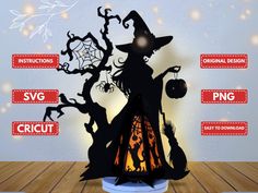 a paper cut out of a witch standing in front of a tree with halloween decorations