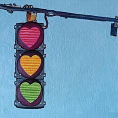 a painting of a traffic light with hearts hanging from it's lightshadow