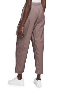 Cargo pockets and a relaxed fit give your off-duty look a utilitarian finishing touch in woven sweatpants finished with an adjustable drawcord waist. 29 1/2" inseam; 19" leg opening; 12 1/2" front rise; 17" back rise (size Medium) 100% nylon Machine wash, tumble dry Imported Utility Style Sweatpants For Loungewear, Relaxed Fit Cargo Parachute Pants Ankle-length, Relaxed Fit Cargo Style Parachute Pants, Relaxed Fit Ankle-length Cargo Parachute Pants, Utility Sweatpants With Pockets And Relaxed Fit, Utility Style Relaxed Fit Sweatpants With Pockets, Utility Style Sweatpants With Pockets And Relaxed Fit, Utility Relaxed Fit Joggers For Loungewear, Relaxed Fit Utility Joggers For Loungewear