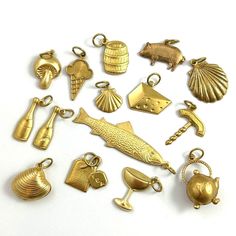 Food & Beverage Themed Charms -Quantity: 1 Charm -Choose your charm from the drop down menu -Mix of vintage and modern brass charms -These also make a fun little gift for someone special! ITEM DESCRIPTION For this choose a charm listing, I went with a food and beverage theme!  The charms are a mix of vintage and modern, all brass metal. Many are stampings (slightly dimentional on the front and hollow on the back), a few are puffy (double sided and hollow on the inside), and the rest have a flat Gold Jewelry With Dangling Charms For Birthday, Themed Charm Jewelry For Birthday, Themed Birthday Jewelry With Charms, Novelty Gold Jewelry Gift, Themed Gold Jewelry For Party, Gold Novelty Charm Necklaces For Gifts, Gold Novelty Charm Necklace For Gifts, Gold Novelty Jewelry For Party, Novelty Gold Jewelry For Birthday