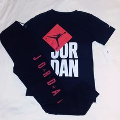 Brand New Never Worn With Tags. Jordan Set Includes A Black Short Sleeve Cotton Blend Tee With Red And, White Trim And Classic Jordan Jumpman Print With "Air Jordan" Inscription And Jumpman Logo On Left Sleeve. Bottoms Are Black Cotton Blend Design With Red Trim With Elastic Waistline And Jumpman Logo On Left Leg. Set Fits Boys Youth Large (12- 14 Yrs). Any Questions, Please Contact Me. Thanks! Trendy Black Crew Neck Sets, Casual Red Sets For Streetwear, Black Crew Neck Sports Set, Sporty Black Crew Neck Set, Trendy Crew Neck Streetwear Sets, Trendy Streetwear Set With Crew Neck, Black Short Sleeve Sets For Streetwear, Black Short Sleeve Streetwear Sets, Sports Graphic Print Crew Neck Sets