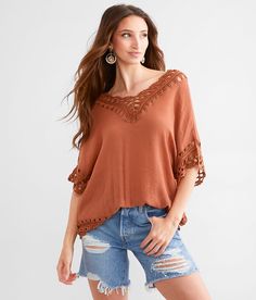 Women's Macrame Top In Brown By Daytrip., Women's Henna Textured knit handkerchief hem top Bust measures 42 on size small Body length 23 on size small. 100% Polyester. Hand wash cold. Do not bleach. Lay flat to dry. Cool iron if needed.. Measurements: Bust -Fullest part of bust with arms at sides. Waist -Circumference of natural waist: above belly button below rib cage. Hips -Standing with feet together fullest part of hips. WOMEN'S TOP SIZE CONVERSION CHART Size US/CAN BUST WAIST XXS 00 29-30 2 Fall Crochet V-neck Top With Crochet Trim, Beach Tops In Pointelle Knit For Fall, Pointelle Knit Beach Tops For Fall, Knit Tops For Vacation In Fall, Beach Fall Pointelle Knit Tops, V-neck Rayon Top For The Beach, Bohemian Open Knit Top For Summer, Bohemian Knit Top For Summer Day Out, V-neck Knit Top For Beach Outing In Fall