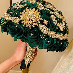 a bridal bouquet is being held by someone