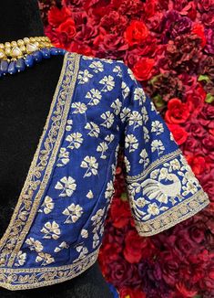 Subtle hues of whimsy blend with floral embroideries in this Royal Blue lehenga. The mehreen lehenga, embroidered with beautiful floral motifs and golden embroidery work, looks every bit of the royal self! Color - Fabric & Work Style -- Silk lehenga: Rich embroidery, floral embroidery work.- Silk embroidered blouse.- Net dupatta. Details -- Assured quality.- Wash care instruction: Dry clean only.- Slight variation in color is possible due to digital photography. Embroidered Banarasi Silk Choli For Navratri, Diwali Embroidered Semi-stitched Lehenga, Embroidered Semi-stitched Choli With Traditional Drape, Festive Bollywood Embroidered Lehenga, Wedding Multicolor Floral Embroidered Anarkali Set, Wedding Floral Embroidered Anarkali Set, Elegant Multicolor Embroidery Sets For Reception, Festive Chanderi Lehenga With Zari Work, Fitted Traditional Lehenga With Resham Embroidery