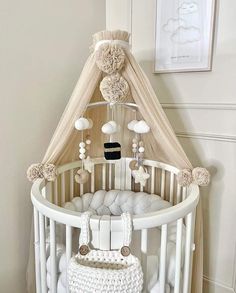 a white crib with some decorations on it