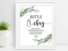 a framed poster with the words bottle ackg on it next to a potted plant