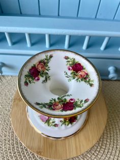 two plates stacked on top of each other in front of a blue bed headboard