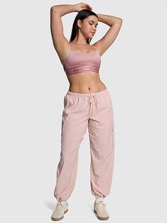 Find PINK Tech Stretch Cargo Pants on Editorialist. The Takeaway: Cargo up and conquer your 'fit Take this staple from campus to wherever for a cool, comfy look. Made in our new Tech Stretch fabric that's lightweight, cool and breezy for all your summer fun. Low rise Relaxed fit Two back pockets Two side cargo pockets Quick-dry, sweat-wicking fabric Adjustable bungee cord at ankle Imported Pink Activewear With Elastic Waistband, Pink Sweatpants With Elastic Waistband For Sports, Pink Sportswear Pants With Elastic Waistband, Sporty Pink Parachute Pants, Pink Athleisure Joggers With Elastic Waistband, Sporty Go-dry Pink Yoga Pants, Sporty Pink Go-dry Yoga Pants, Pink Relaxed Fit Sports Joggers, Pink Relaxed Fit Sporty Joggers