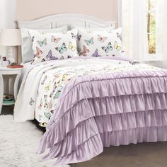 PRICES MAY VARY. This beautiful piece combines serene elegance with fashionable style. The top portion is created with a colorful array of graceful butterflies, while the bottom portion is clothed with gorgeous ruffles where the butterflies will eventually land to rest. Spoil your little one with colors, ruffles and butterflies! This enchanting quilt set brings bursts of imagination and fun to their bedroom decor. The inviting style of this quilt and generous size is the perfect bedding for your Oversized Quilt, Butterfly Room, Big Kids Room, Butterfly Quilt, Lush Decor, غرفة ملابس, Bedding Stores, Coverlet Set, Reversible Quilt