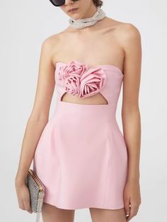 Make a bold statement in our Strapless Cutout Mini Dress, showcasing sleek lines and daring cutouts for a captivating look. Perfect for nights out or special events, this dress exudes confidence and style, ensuring all eyes are on you. Chic Pink Bandage Dress For Party, Chic Bodycon Dress With Cut-out Waist For Date Night, Spring Formal Strapless Bodycon Dress, Spring Formal Bodycon Strapless Dress, Spring Strapless Bodycon Dress For Formal Occasions, Elegant Spring Dress With Boning, Glamorous Spring Gala Mini Dress, Elegant Spring Mini Dress With Boning, Chic Pink Mini Dress For Evening