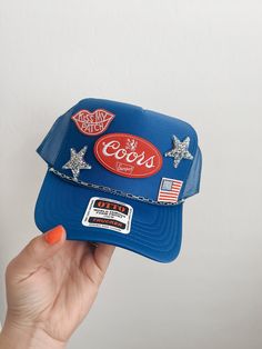 This custom made trucker patch hat is perfect for any occasion whether it be for spring/summer time, a lake hat, a gift for someone, or just a cute accessory to add a little spice to your outfit 🧢✨ DETAILS-  * This hat is one size with an adjustable SnapBack that is adjustable from 20in. - 23.5in. * The color of this hat is Blue * The material of the hat is polyester with iron on patches  REFUNDS AND CANCELLATIONS- Every hat is handmade by me as a result, a slight variation can occur from the picture with patch size or placement. If you have any problems with your hat please message me within 24 hours of receiving your order and I'd be happy to help! No refunds or exchanges will be accepted after. CONNECT- To enter giveaways, discount codes, or behind the scenes, follow our pages. 📲 Inst Summer Trucker Baseball Cap, Summer Hats With Logo Patch And Curved Brim, Summer Trucker Snapback Hat, Curved Brim Hats With Logo Patch For Summer, Curved Brim Summer Hats With Logo Patch, Trendy Baseball Cap With Patches And Curved Brim, Summer Trucker Cap, Flat Brim Hats With Logo Patch For Spring, Trendy Blue 5-panel Snapback Hat