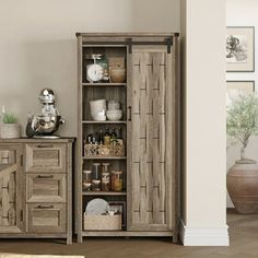 a wooden cabinet with drawers and shelves in a living room