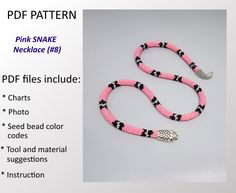 a pink snake necklace with black and white beads on it's end is shown