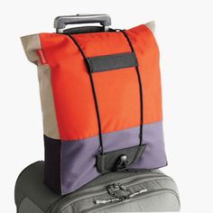 two pieces of luggage sitting on top of each other in front of a white background