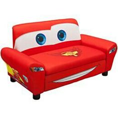 a red couch with blue eyes and lightning bolt on it's head, sitting in front of a white background