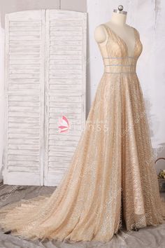 Gold V-neck Evening Dress With Sweep Train, Elegant V-neck Gown For Pageants, Glamorous Gold Sparkling Evening Dress, Gold Glitter Dress For Wedding, Glamorous Gold Evening Dress With Sweep Train, Gold Backless Gown For Prom, Gold Shimmer Dress For Wedding, Gold Sparkling Gown For Prom Season, Gold Sparkling Gown For Gala