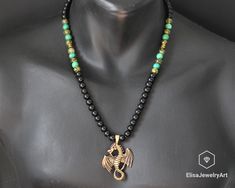 Men's Dragon Necklace Natural Black Onyx Dragon Vein Agate Turquoise Gemstone Protection Beaded Adjustable Macrame Necklace Christmas Gift -ALL THE PRODUCTS AT ELISAJEWELRYART ARE HANDMADE AND MADE WITH NATURAL BEADS. -WHAT DOES THE TURQUOISE STAND FOR Turquoise promotes self-realisation and assists creative problem solving. It is a symbol of friendship, and stimulates romantic love. Turquoise aids in the absorption of nutrients, enhances the immune system, stimulates the regeneration of tissue, Green Jewelry With Black Beads As A Gift, Green Jewelry With Black Beads For Gift, 8mm Bead Pendant Jewelry As Gift, Turquoise Necklace With Black Beads As Gift, Turquoise Jewelry With Black Beads For Gift, Hand-strung Onyx Jewelry As A Gift, Black Bohemian Turquoise Necklace As A Gift, Bohemian Black Turquoise Necklace As Gift, Black Bohemian Turquoise Necklace Gift