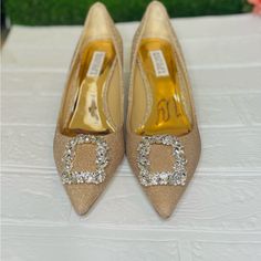 Badgley Mischka Cher Crystal Buckle Pumps Gold Glitter Satin Brand New With Tags Us Size 8 Crystal Embellishments Padded Metallic Footbed Stiletto Heel Pointed Toe Approx 3 3/4" Heel Happy Shopping ! A Gorgeous Crystal Brooch Crowns The Pointed Toe Of A Glossy Satin Pump Lifted By A Tapered Heel. Thank You! Holiday Wedding Heels With Glitter Accents, Elegant Low Heel Heels With Glitter Accents, Elegant Low Heels With Glitter Accents, Glitter Fitted Wedding Shoes For Formal Occasions, Gold Glitter Wedding Shoes For Evening, Fitted Glitter Wedding Shoes For Formal Occasions, Formal Wedding Shoes With Glitter, Formal Fitted Glitter Wedding Shoes, Glitter Closed Toe Wedding Shoes For Events