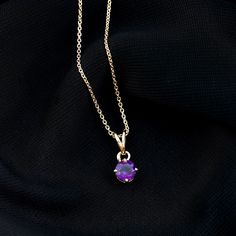 Product Details Be Dazzle with this Beautiful Amethyst Solitaire Pendant necklace and get Admiration. The Pendant is embellished with 5 MM Round Shape Amethyst Solitaire as single stone in 4 Prong Diagonal Setting. Solid Gold encasing around Gemstone and Rabbit Ear Bail make this Pendant more Elegant. Product Information SKU SHP-PENDANT0621102661 Length 11 mm Width 6 mm Weight 3.75 gm (Approximate) AMETHYST INFORMATION No.of Stones 1 Pieces Total Weight 0.45 Carat (Approximate) Dimension(approx) Solitaire Pendant Necklace, Rabbit Ears, Single Stone, Solitaire Pendant, Amethyst Necklace, Signature Jewelry, Timeless Jewelry, Conflict Free Diamonds, Stone Pendants