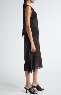 Peter Do achieves elegant simplicity with the airy, sheer construction of this sleeveless shift dress. 46" length (size Medium) Hidden back-zip closure Jewel neck Sleeveless Unlined Sheer 100% polyester Dry clean Made in the USA Designer Clothing Asian & Pacific Islander Owned/Founded Sheer Sleeveless Silk Maxi Dress, Sleeveless Sheer Silk Maxi Dress, Sheer Sleeveless Maxi Dress, Sheer Slip Dress For Summer Evenings, Elegant Sheer Sleeveless Slip Dress, Elegant Sheer Midi Beach Dress, Chic Summer Slip Dress With Sheer Back, Elegant Sheer Midi Dress For Beach, Sheer Sleeveless Summer Slip Dress