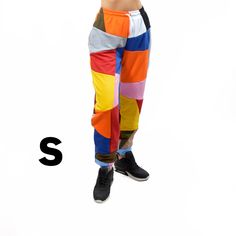 We offer a unique and colorful patchwork design pants. The colors of each model are unique and not repeatable. Add stylish and vibrant notes to your look. This demi-season clothes is made of the highest quality cotton fabric, very comfortable and pleasant to the touch. The pants are very comfortable and do not restrict movement, suitable for home, jogging, yoga, walking in the fresh air. If you like bright and unusual things, then this sweatpants will be a great choice for you or for those to wh Stretch Cotton Color Block Bottoms, Stretch Cotton Bottoms With Color Block, Trendy Multicolor Color Block Pants, Sporty Cotton Sweatpants With Contrast Color, Sporty Stretch Multicolor Pants, Multicolor Patchwork Pants For Loungewear, Trendy Stretch Patchwork Pants, Multicolor Relaxed Fit Cotton Sweatpants, Multicolor Cotton Relaxed Fit Sweatpants