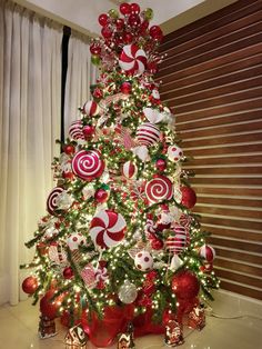 a christmas tree decorated with candy canes and ornaments