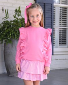 The Laura Girl's Ruffle Pullover in Pink is a darling addition to any young girl's wardrobe! With two rows of ruffles, this top is both cute and perfect for fall events like school and play dates. Stay stylish and cozy with this must-have piece! Pink Fall Playwear Top, Cute Top With Ruffled Collar, Cute Ruffle Sleeve Top With Ruffle Hem, Playful Long Sleeve Tops With Ruffles, Playful Ruffle Tops For Playwear, Playful Ruffled Tops For Playwear, Cute Ruffled Collar Tops For Fall, Cute Long Sleeve Tops For Playdate, Casual Ruffled Tops For School