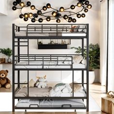 a bunk bed with lights hanging from the ceiling and stuffed animals on the bottom shelf