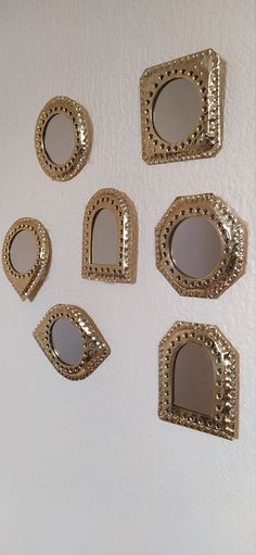 six mirrors are arranged on the wall