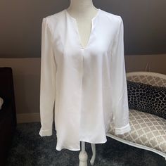 Tibi Silk Top. Nwt. Perfect Condition. V-Neck. Lined In Front. Measurements Taken Flat And Are Approximate. Armpit To Armpit: 18” Shoulder To Hem: 27.5” Pet Friendly And Smoke Free Home. Questions? Leave A Comment Below! Elegant V-neck Blouse For Brunch, Elegant V-neck Top For Spring Workwear, Spring V-neck Top With Notched Neckline For Work, Chic V-neck Top For Spring Formal Events, Chic V-neck Top For Formal Spring Occasions, Chic Spring Formal V-neck Top, Elegant White V-neck Top For Work, Chic Split Neck Top For Brunch, Elegant Split Neck V-neck Top For Spring