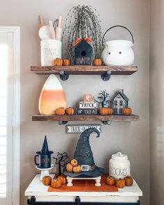 two shelves with halloween decorations on them